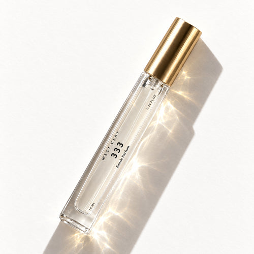 333 Eau de Parfum by West Clay, 10 mL travel size flash flat lay studio photo