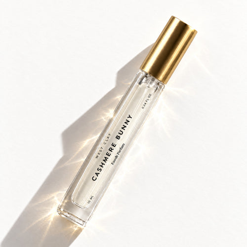 Cashmere Bunny Eau de Parfum by West Clay, 10 mL travel size flash flat lay studio photo