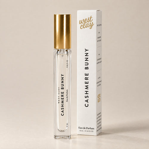 Cashmere Bunny Eau de Parfum by West Clay, 10 mL travel size vial and box studio photo