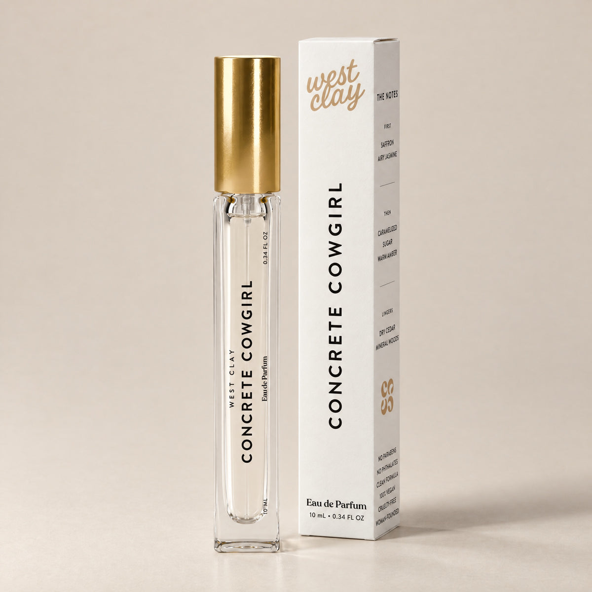 Concrete Cowgirl Eau de Parfum by West Clay, 10 mL travel size vial and box studio photo