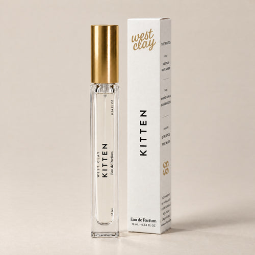 Kitten Eau de Parfum by West Clay, 10 mL travel size vial and box studio photo